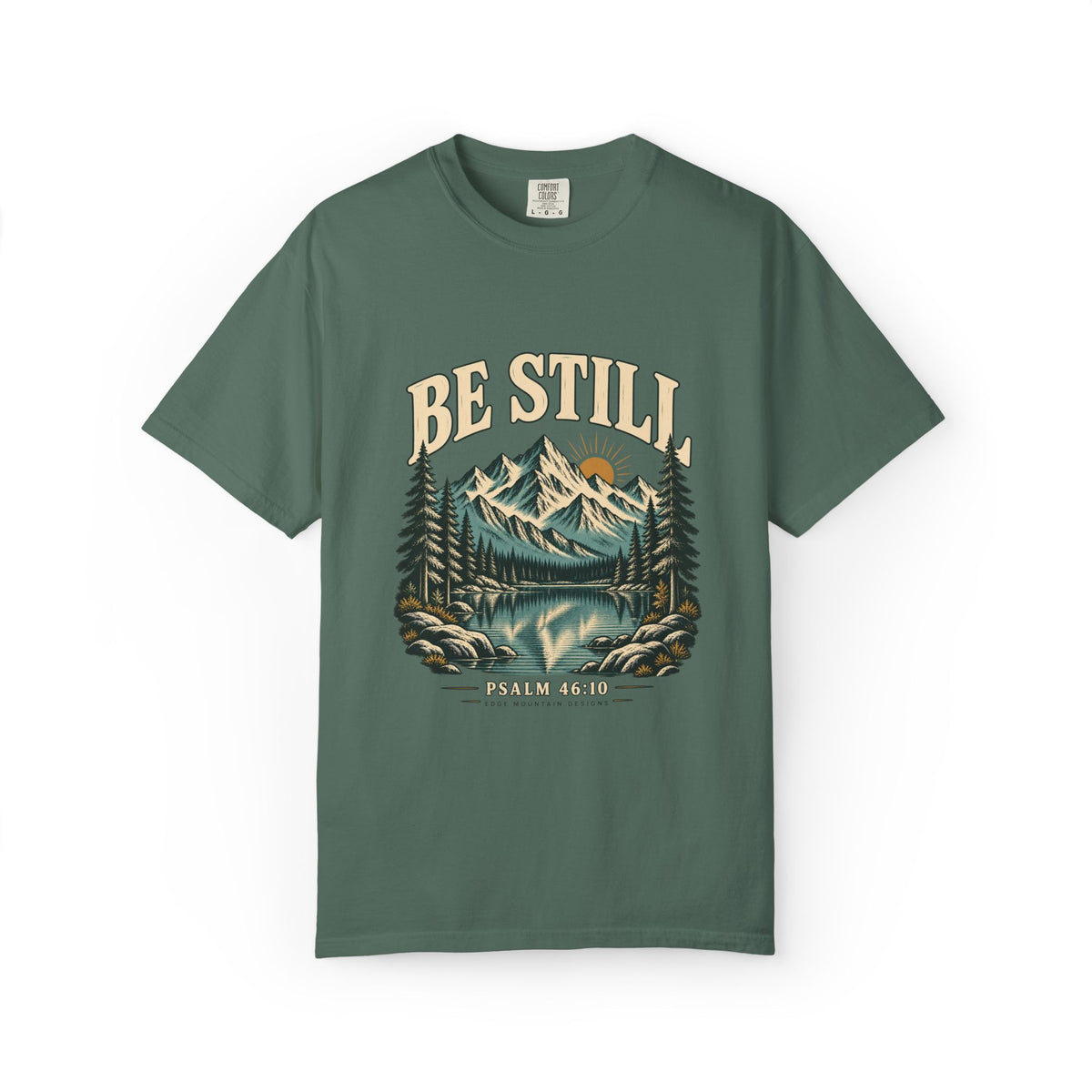 Blue Spruce Comfort Colors 1717 T-shirt with Be Still mountain, lake, pine trees, and Psalm 46:10 front graphic.